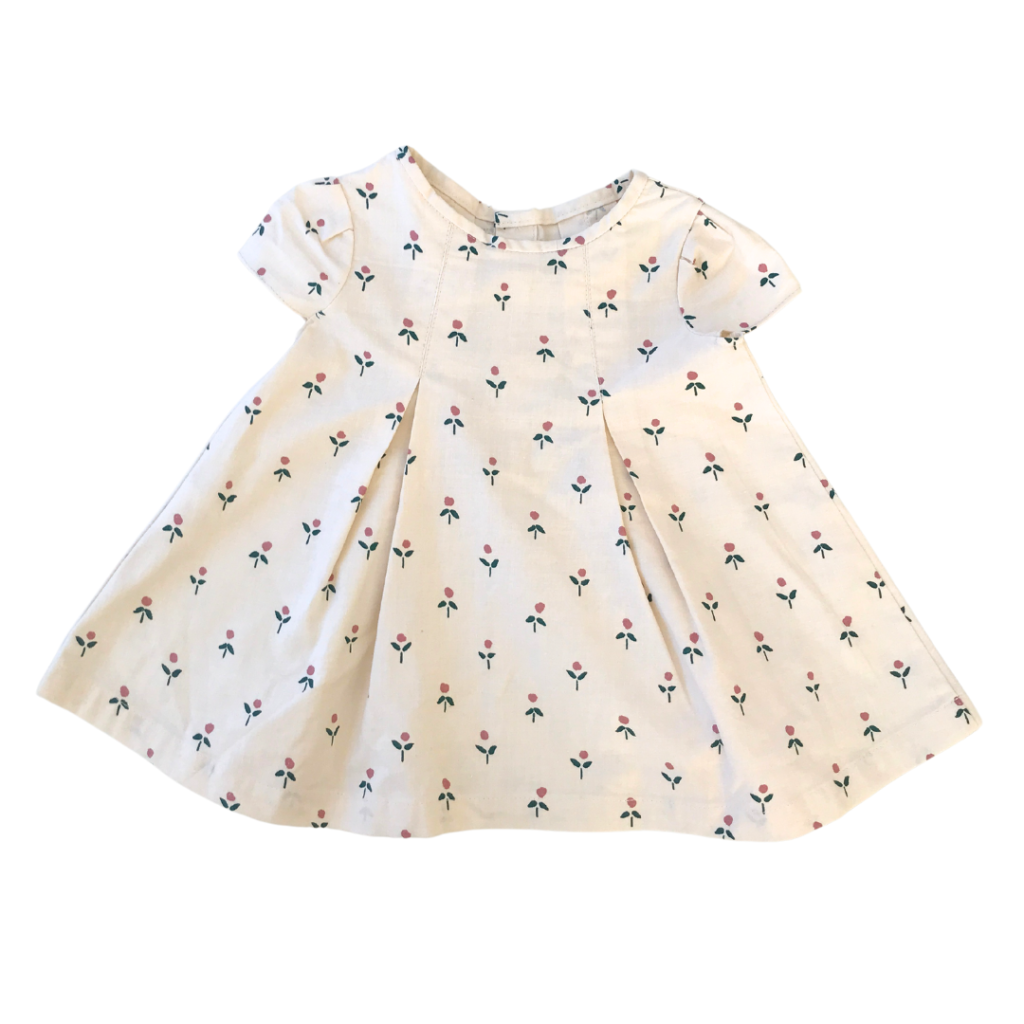 Beige klänning med vita blommor (st 68-74)